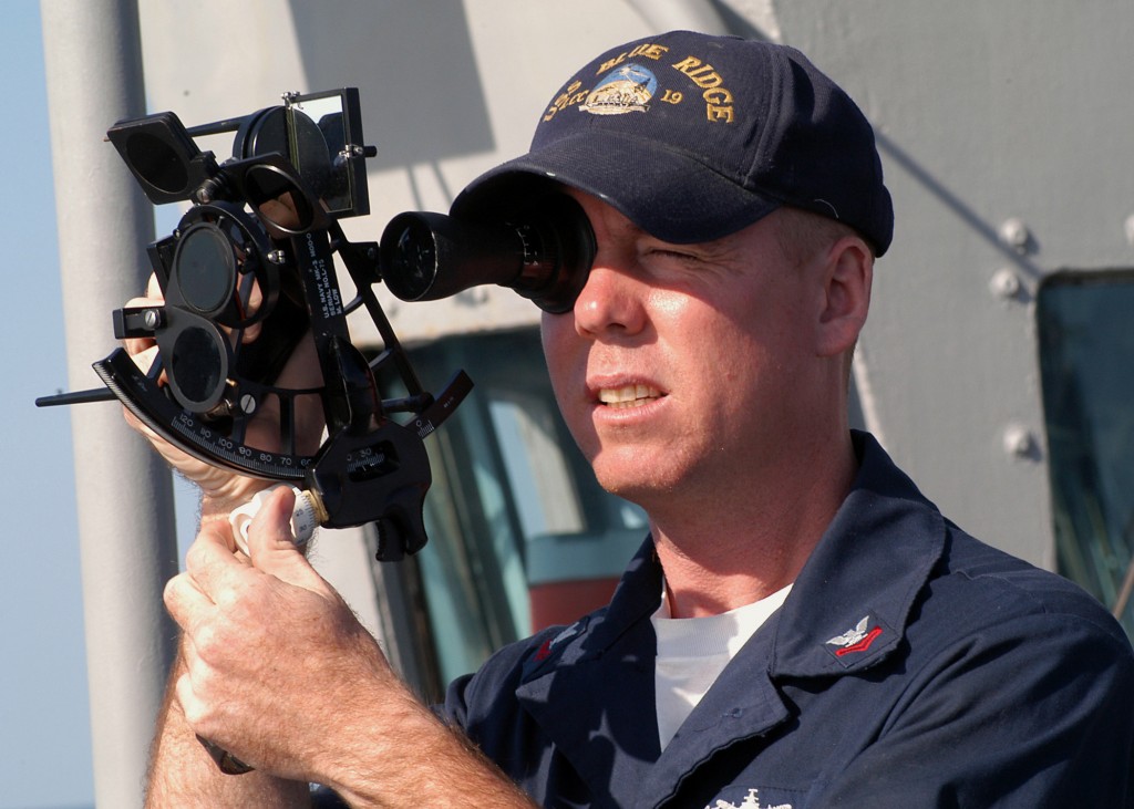 031025-N-8955H-005 Aboard USS Blue Ridge (LCC 19) Oct. 25, 2003 -- Quartermaster 2nd Class Martineau, from Ft. Lauderdale, Fla., uses a sextant to shoot the sun line from the port bridge wing of USS Blue Ridge (LCC 19). U.S. Navy photo by PhotographerÕs Mate 1st Class Novia E. Harrington. (RELEASED)